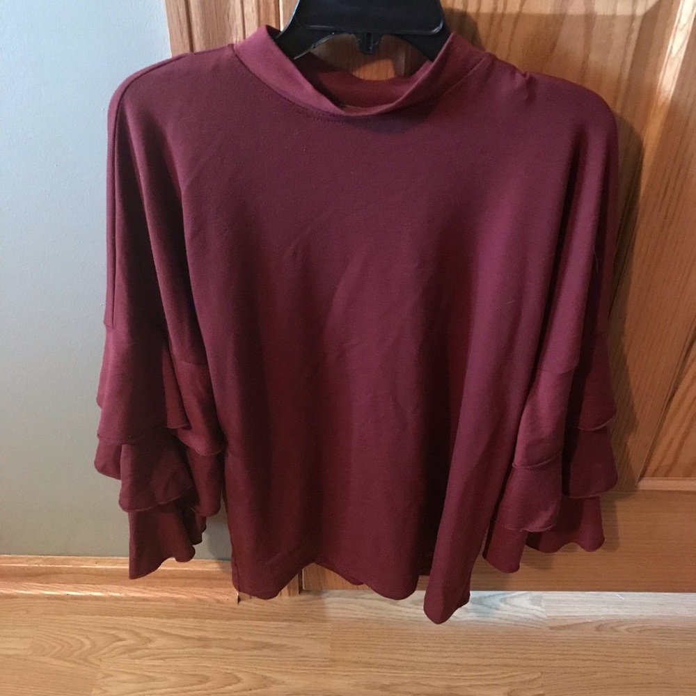 New without tags. Never worn xl long sleeved.